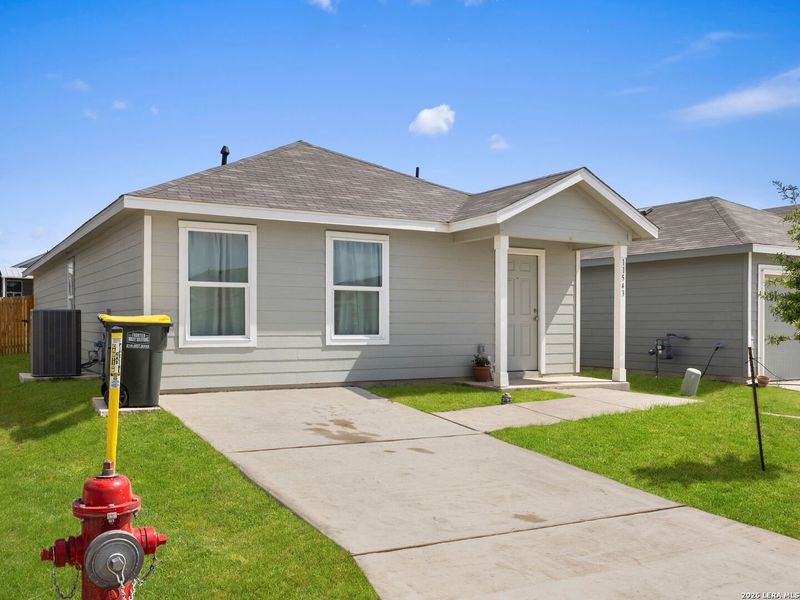 Front exterior of a new home in Rose Valley, Converse, TX, highlighting curb appeal (Image 22).
