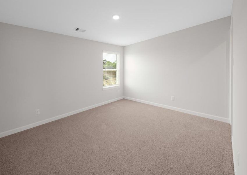 Secondary bedroom with carpet