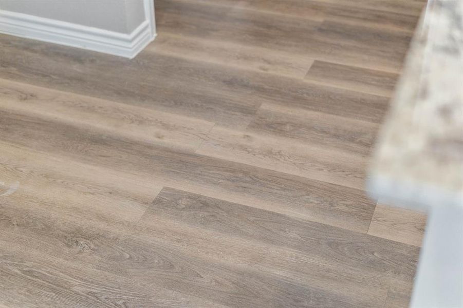 Laminate flooring throughout the home.