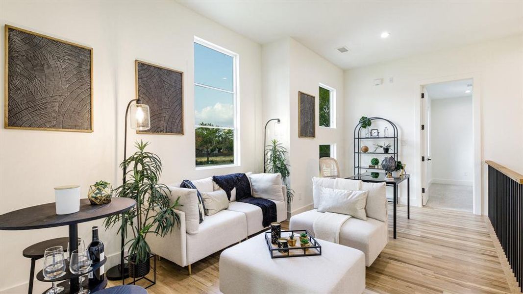 Living room with light wood-type flooring