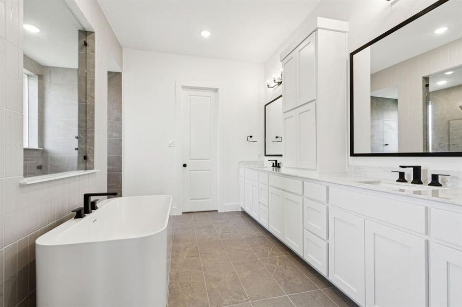 The Pembrooke II floor plan offers our signature spa bath featuring spacious dual vanities, linen cabinet, walk through shower and freestanding tub!