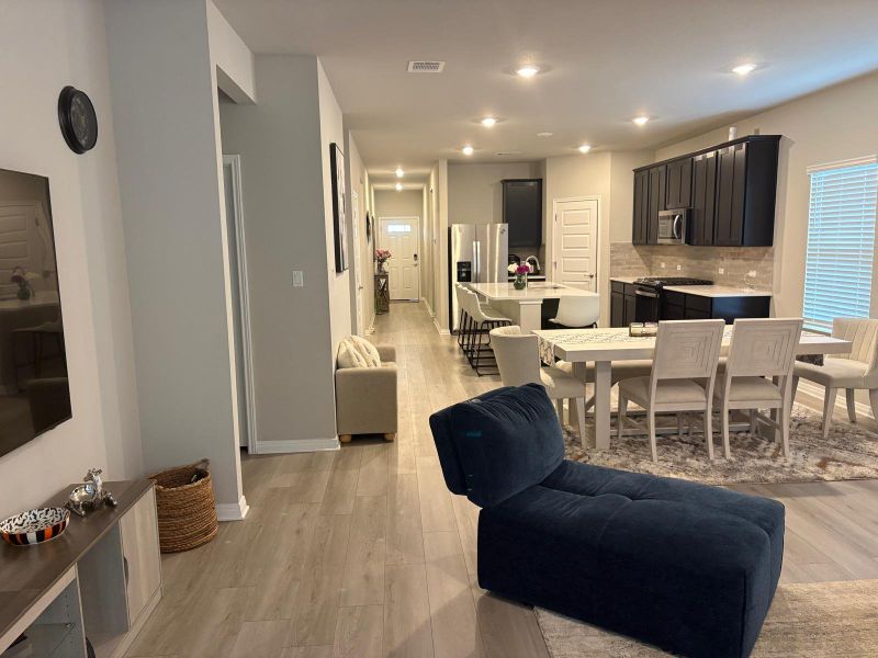 An open floorplan seamlessly connects the well-appointed kitchen to a generous dining area.