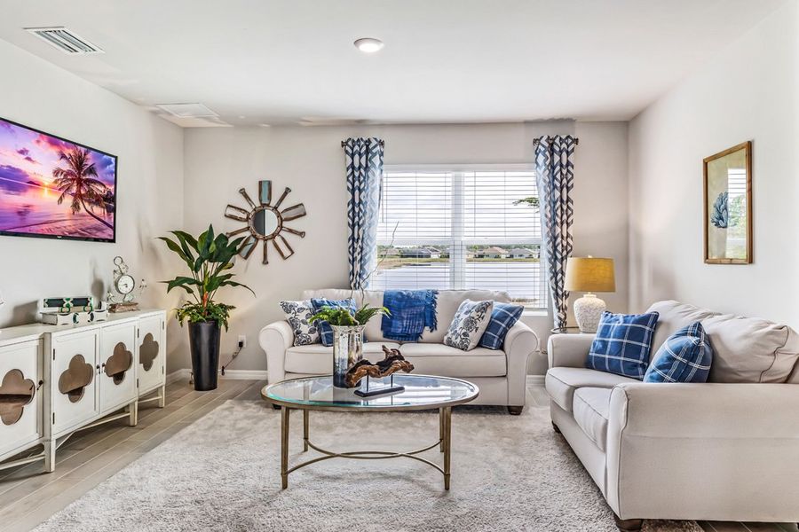 Representative furnished interior of a home built from the Cali by D.R. Horton in Magnolia Landing Express, North Fort Myers (Image 5).