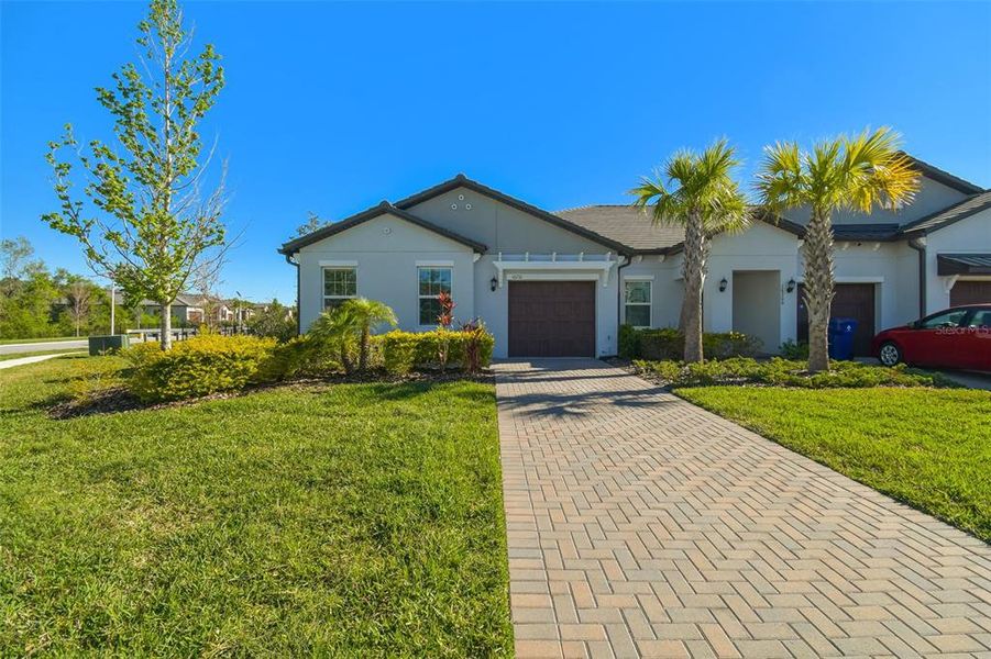 Front exterior of a new home in Angeline Active Adult, Land O' Lakes, FL, highlighting curb appeal (Image 27).