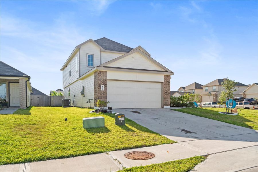 Front exterior of a new home in , Huntsville, TX, highlighting curb appeal (Image 20).