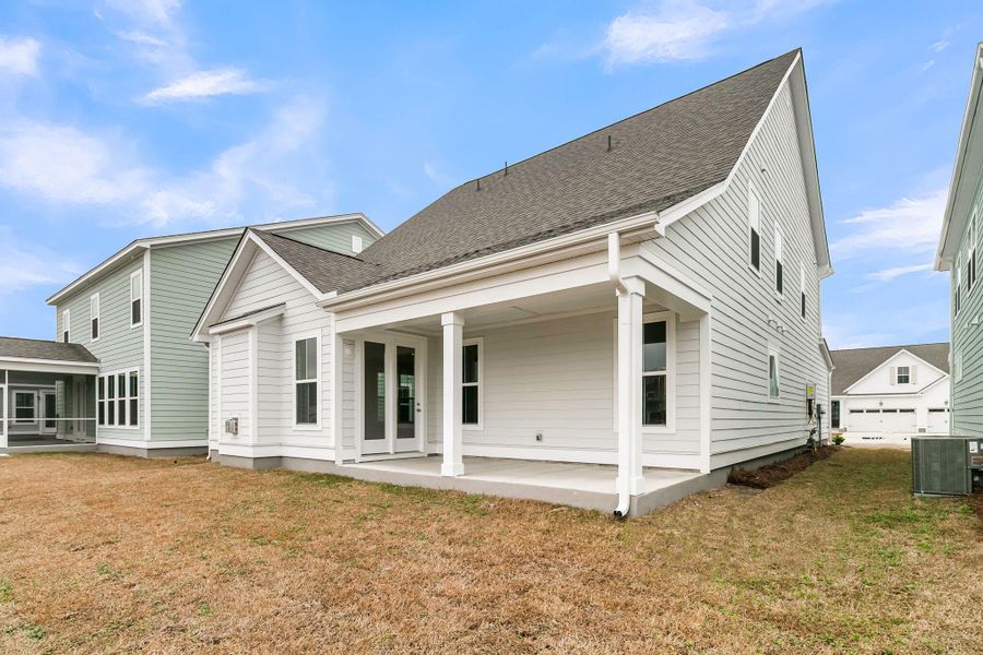Exterior details and patio area of a home in Tidewater at Lakes of Cane Bay, Summerville (Image 4).