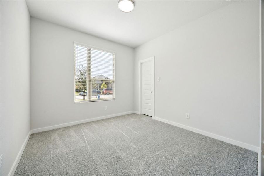 Bedroom in the Emmy II home plan by Trophy Signature Homes - REPRESENTATIVE PHOTO