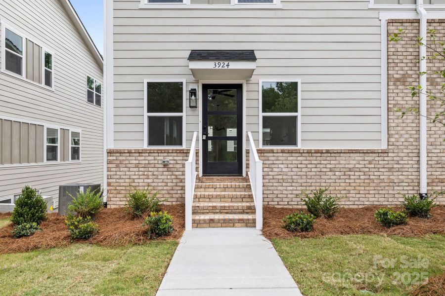 Front exterior of a new home in , Charlotte, NC, highlighting curb appeal (Image 1).