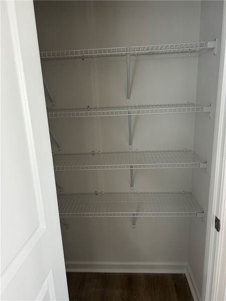 This organized closet offers ample shelving for al