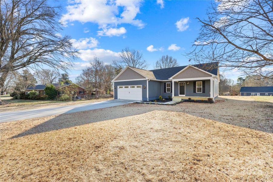 Front exterior of a new home in , Statesville, NC, highlighting curb appeal (Image 20).