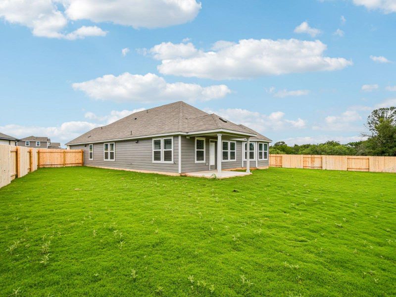 Back of house with a patio area and a fenced backyard Back of house with a patio area and a fenced backyard