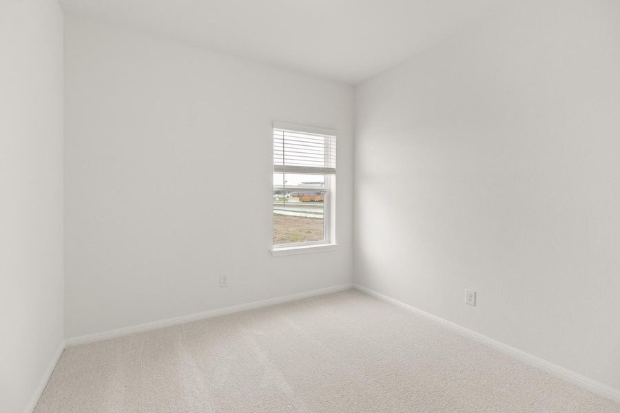 Unfurnished room featuring light colored carpet and baseboards