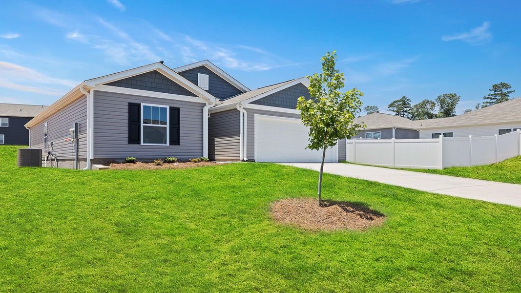 Front exterior of a new home in Treemont Commons, Wellford, SC, highlighting curb appeal (Image 20). Front exterior of a new home in Treemont Commons, Wellford, SC, highlighting curb appeal (Image 20).