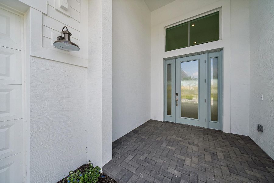 Exterior details and patio area of a home in L'Ambiance at Avenir, Palm Beach Gardens (Image 28).