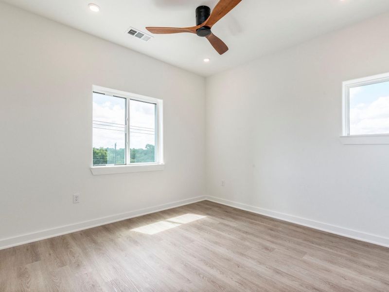 Bedroom boasts natural light, designer fan and a walk in closet Bedroom boasts natural light, designer fan and a walk in closet
