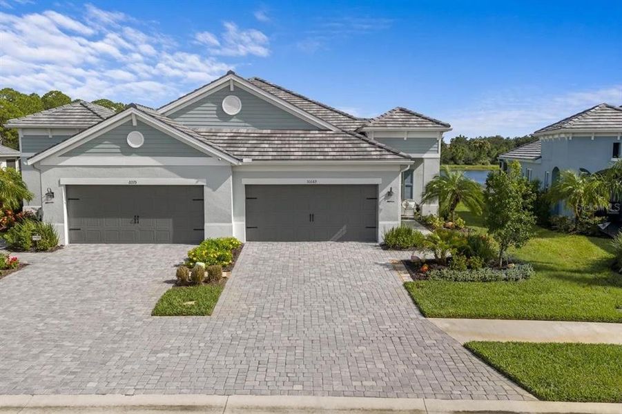 Front exterior of a new home in , Sarasota, FL, highlighting curb appeal (Image 2).