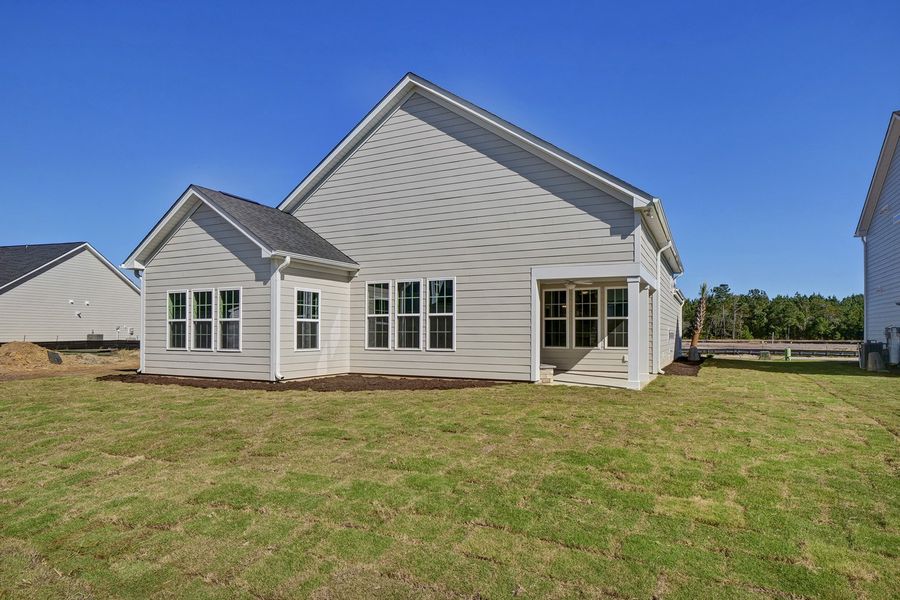 Exterior details and patio area of a home in Grand Park, Leland (Image 17).