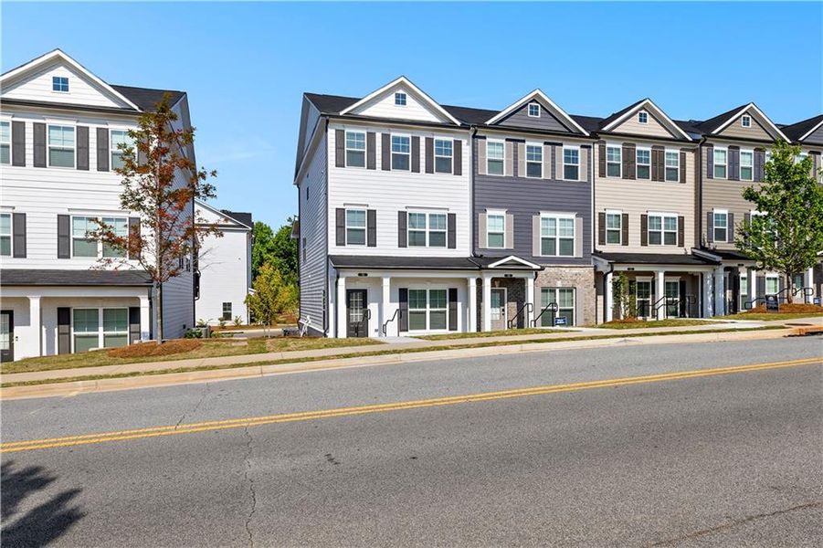 Front exterior of a new home in Nickel Creek at Newnan Crossing, Newnan, GA, highlighting curb appeal (Image 22). Front exterior of a new home in Nickel Creek at Newnan Crossing, Newnan, GA, highlighting curb appeal (Image 22).
