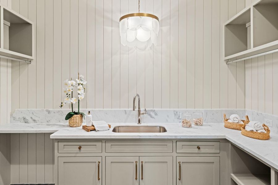 Laundry room with gorgeous design details, functional storage, and full sized sink Laundry room with gorgeous design details, functional storage, and full sized sink