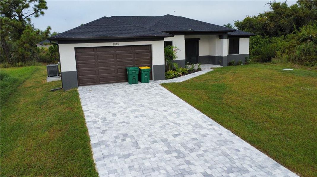 Front exterior of a new home in , Port Charlotte, FL, highlighting curb appeal (Image 2). Front exterior of a new home in , Port Charlotte, FL, highlighting curb appeal (Image 2).