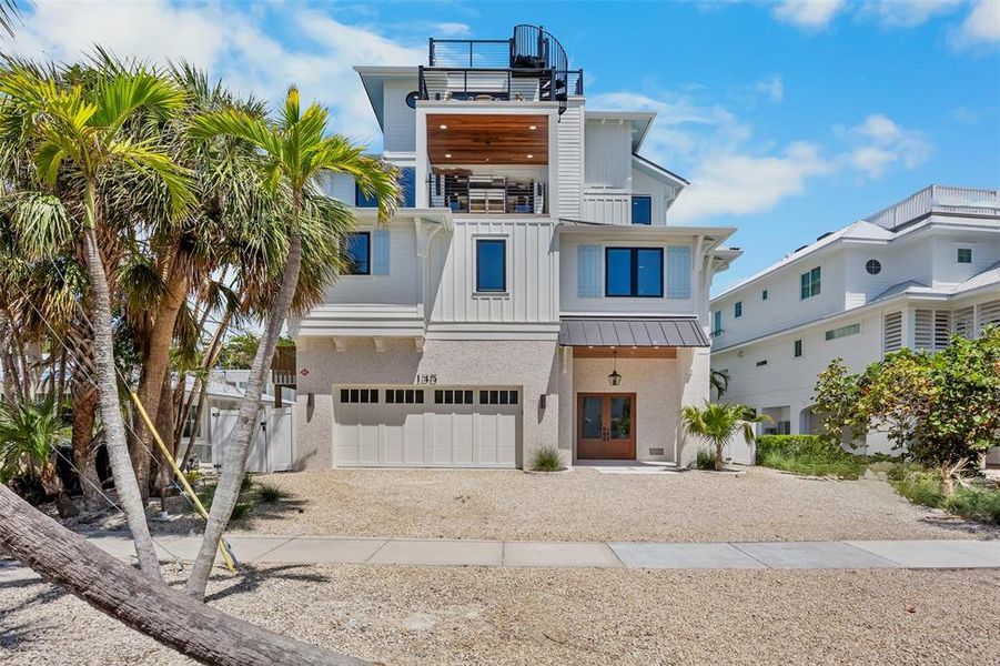 Front exterior of a new home in , Sarasota, FL, highlighting curb appeal (Image 1).