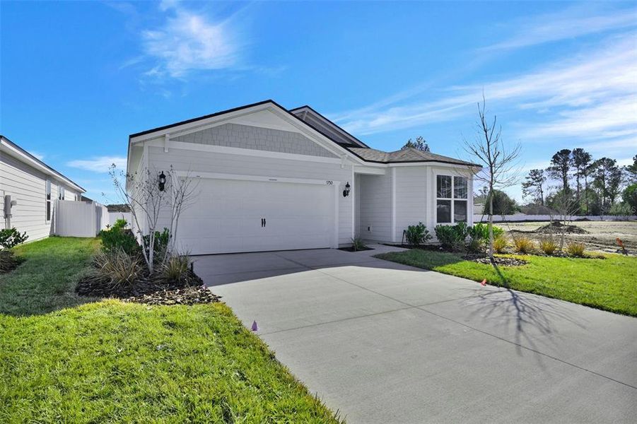 Front exterior of a new home in Lakeview Estates, Palm Coast, FL, highlighting curb appeal (Image 23). Front exterior of a new home in Lakeview Estates, Palm Coast, FL, highlighting curb appeal (Image 23).
