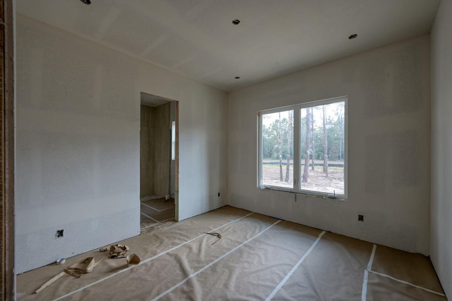 Spacious and private, this secondary bedroom is accessible from the great room with it's own en-suite bathroom using a neutral color palate.