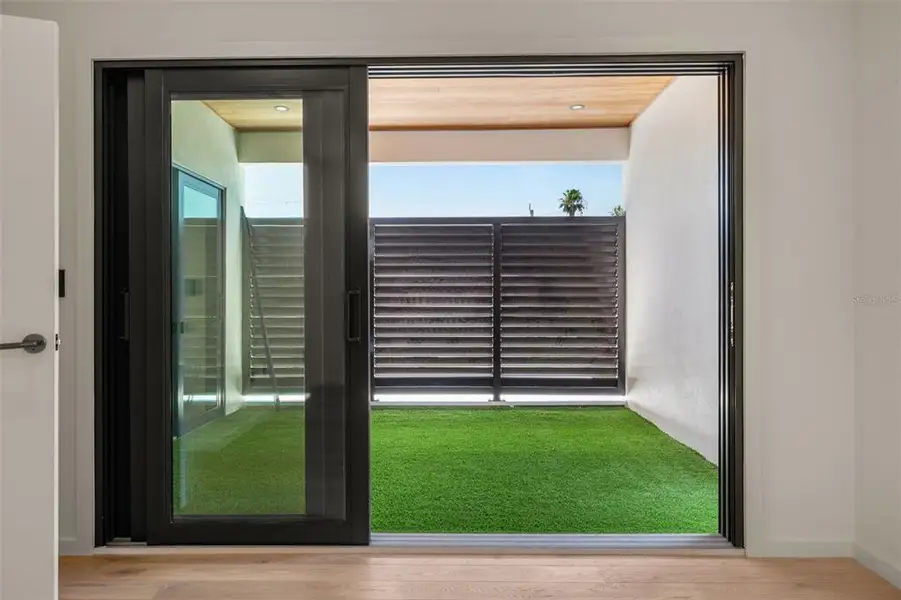 Exterior details and patio area of a home in , Sarasota (Image 38).