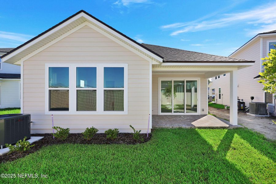 Exterior details and patio area of a home in Crosswinds at Nocatee, Ponte Vedra Beach (Image 4). Exterior details and patio area of a home in Crosswinds at Nocatee, Ponte Vedra Beach (Image 4).