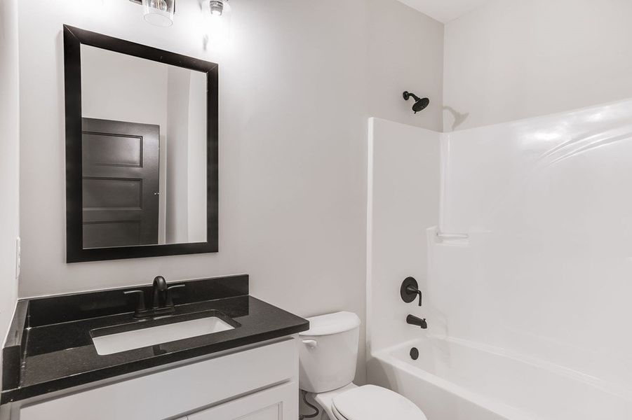 Furnished interior view inside a new home in LOVVORN ESTATES, Carrollton (Image 4).