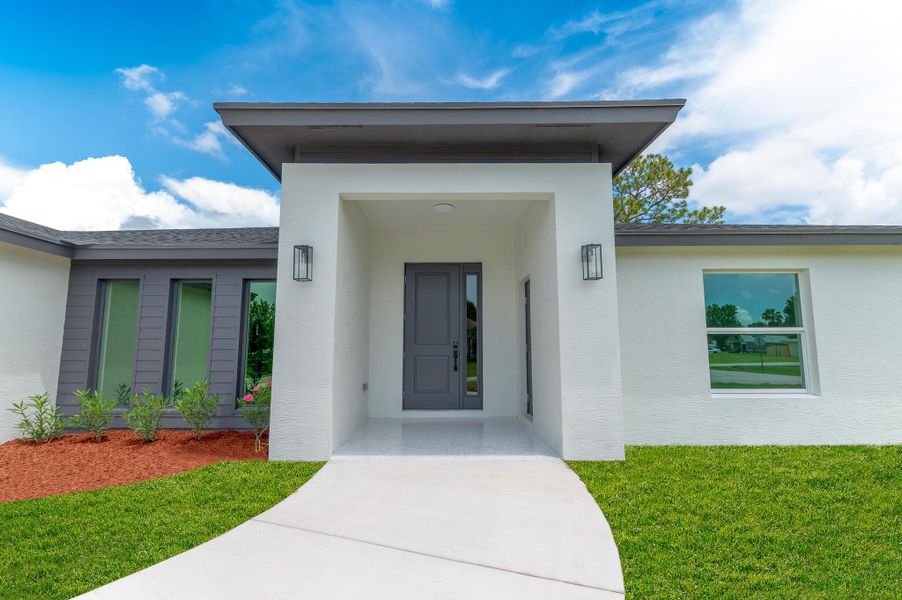 Front exterior of a new home in , Port St. Lucie, FL, highlighting curb appeal (Image 2). Front exterior of a new home in , Port St. Lucie, FL, highlighting curb appeal (Image 2).