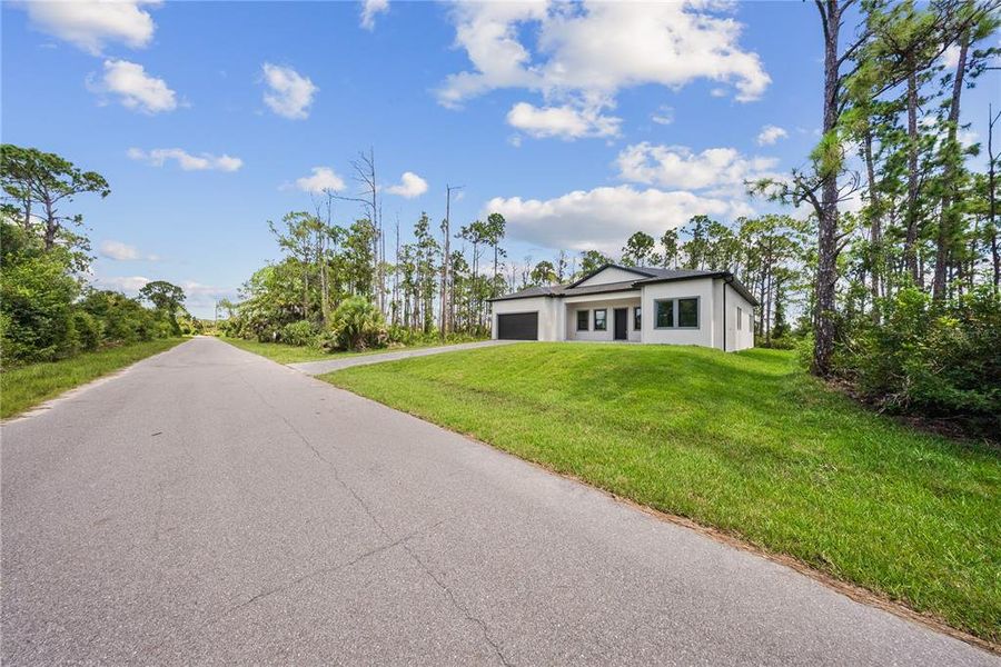 Front exterior of a new home in , Port Charlotte, FL, highlighting curb appeal (Image 35). Front exterior of a new home in , Port Charlotte, FL, highlighting curb appeal (Image 35).