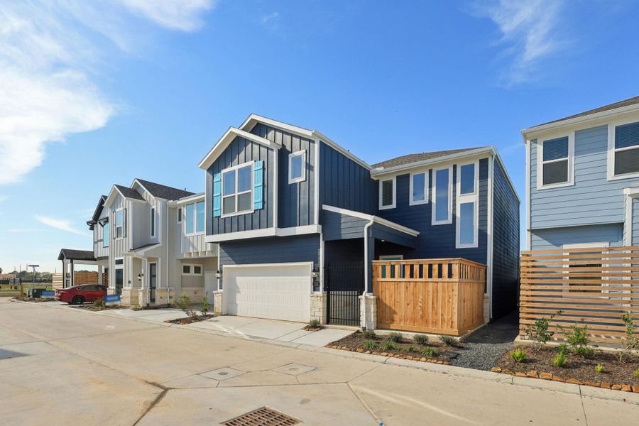Front exterior of a new home in Kemah Crossing - Luxe Series, Kemah, TX, highlighting curb appeal (Image 2). Front exterior of a new home in Kemah Crossing - Luxe Series, Kemah, TX, highlighting curb appeal (Image 2).