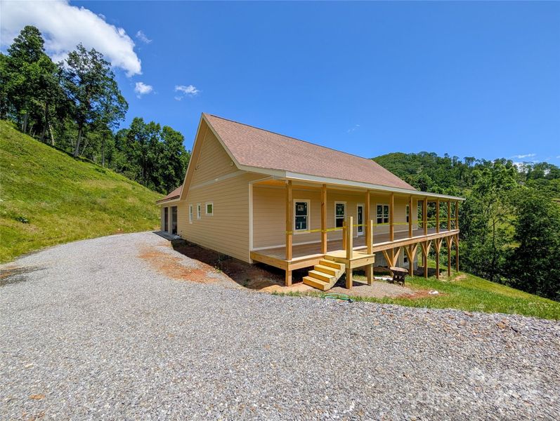 Front exterior of a new home in , Burnsville, NC, highlighting curb appeal (Image 11). Front exterior of a new home in , Burnsville, NC, highlighting curb appeal (Image 11).