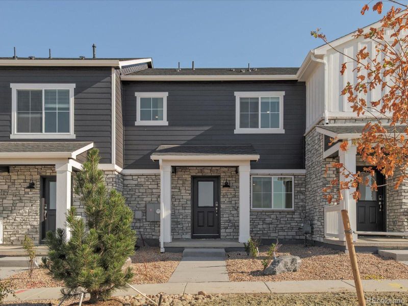 Front exterior of a new home in Skyview at High Point, Aurora, CO, highlighting curb appeal (Image 1).