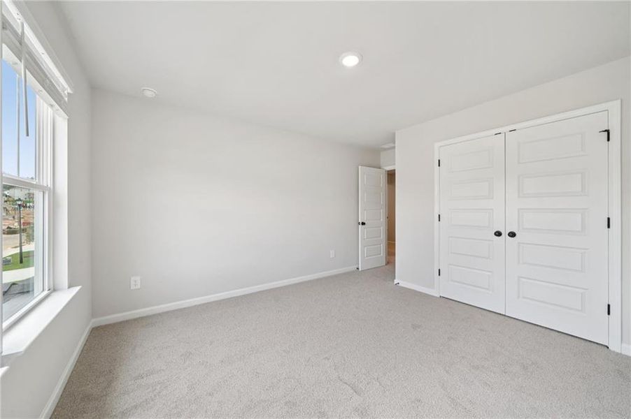 Spacious, unfurnished interior of a new home in Vines at Mill Creek - Estate Series, Braselton (Image 21).