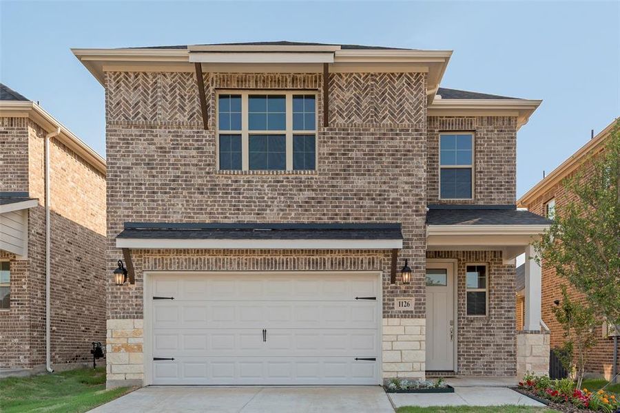 Front exterior of a new home in Walden Pond, Forney, TX, highlighting curb appeal (Image 2). Front exterior of a new home in Walden Pond, Forney, TX, highlighting curb appeal (Image 2).