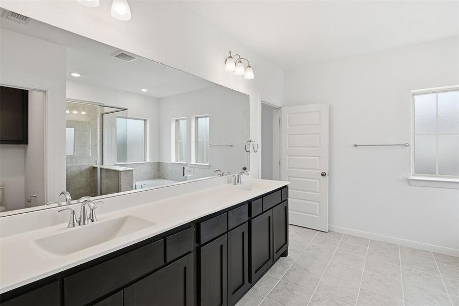 Primary Bathroom with dual vanity.