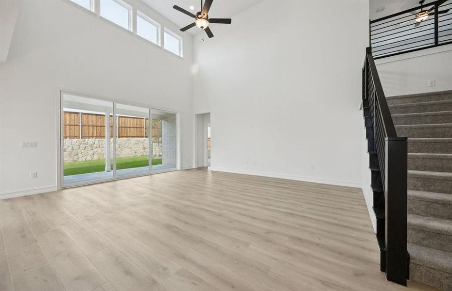 Spacious gathering room with large windows *Model Representation*