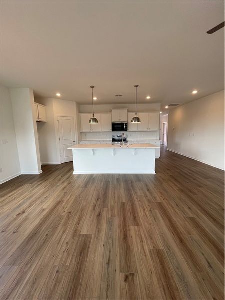 This bright kitchen features an island, ample cabi