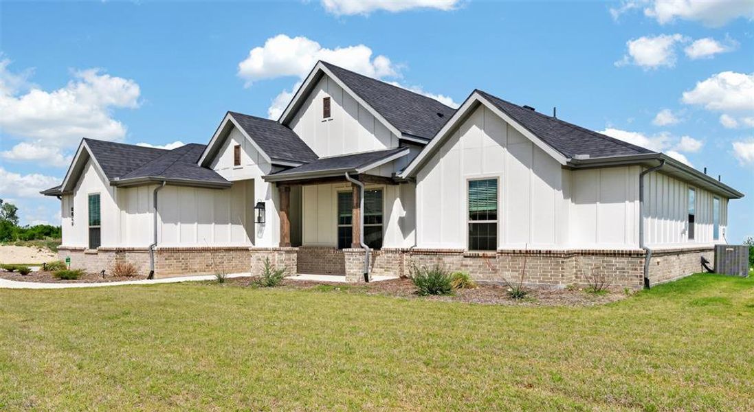 Front exterior of a new home in Gatlin Ranch, Springtown, TX, highlighting curb appeal (Image 24).