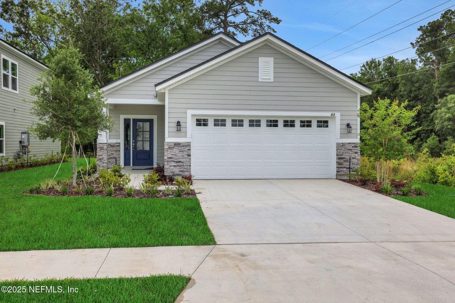 Front exterior of a new home in TrailMark, St. Augustine, FL, highlighting curb appeal (Image 24). Front exterior of a new home in TrailMark, St. Augustine, FL, highlighting curb appeal (Image 24).