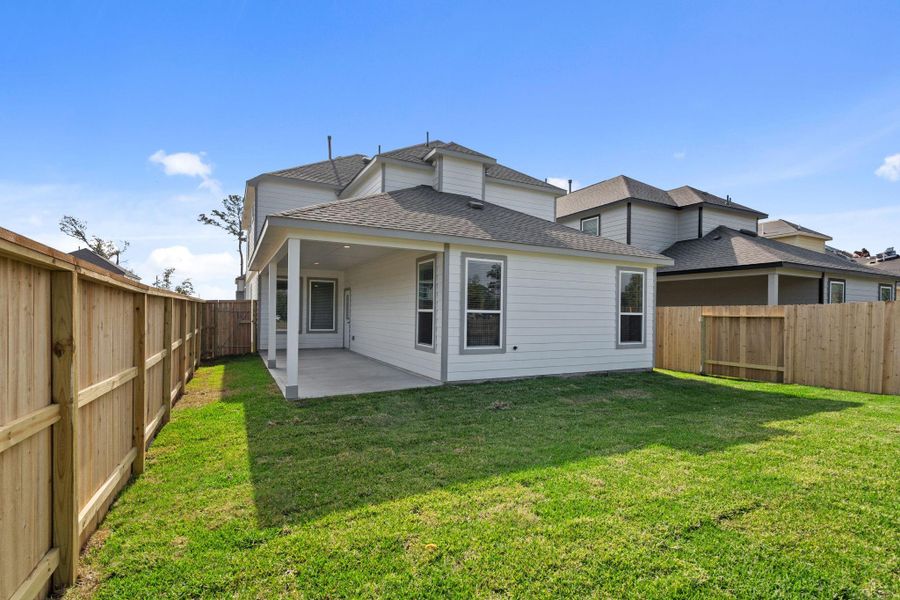 Exterior details and patio area of a home in Cypresswood Landing, Humble (Image 4).