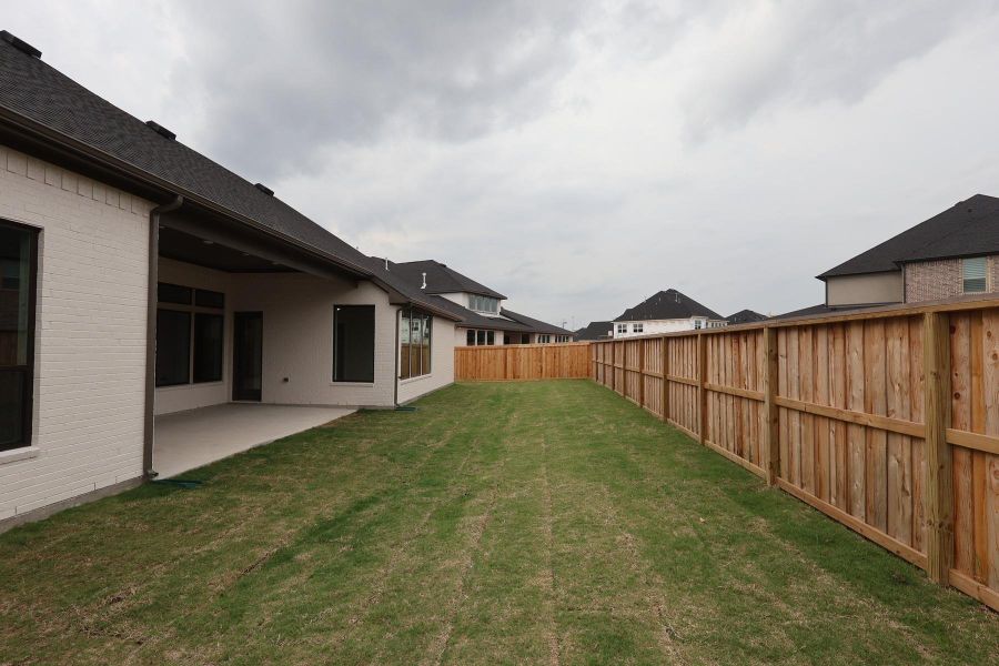 Exterior details and patio area of a home in Dunham Pointe, Cypress (Image 2). Exterior details and patio area of a home in Dunham Pointe, Cypress (Image 2).