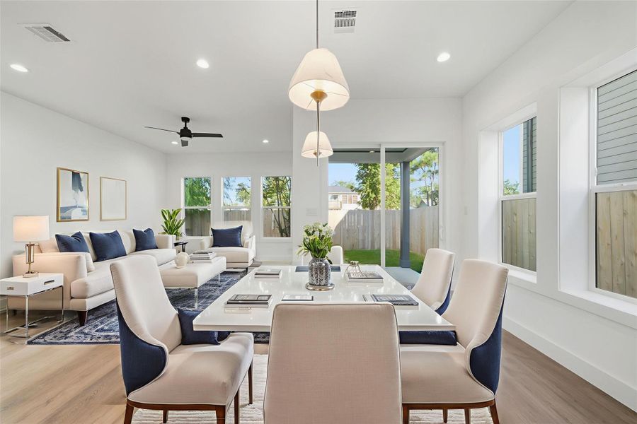 Virtually staged dining and living room. Virtually staged dining and living room.