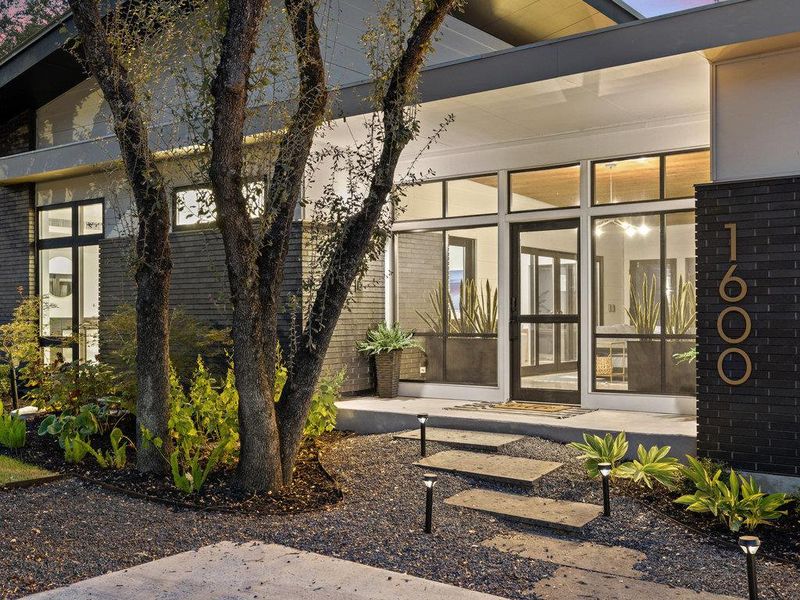 Doorway to property with brick siding