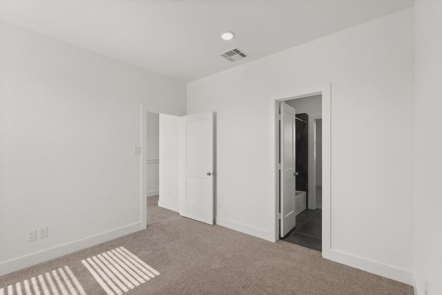 Representative unfurnished interior of a home built from the Cheverny by Chesmar Homes in Sienna Chateau, Missouri City (Image 23).