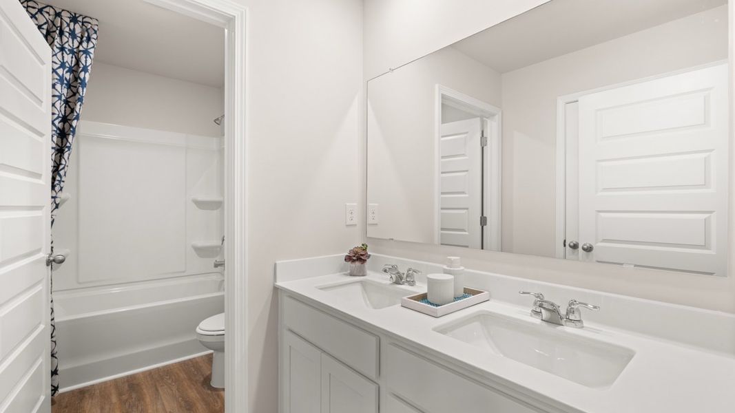 Representative furnished interior of a home built from the Halton by D.R. Horton in Brooks Station, Dacula (Image 51).