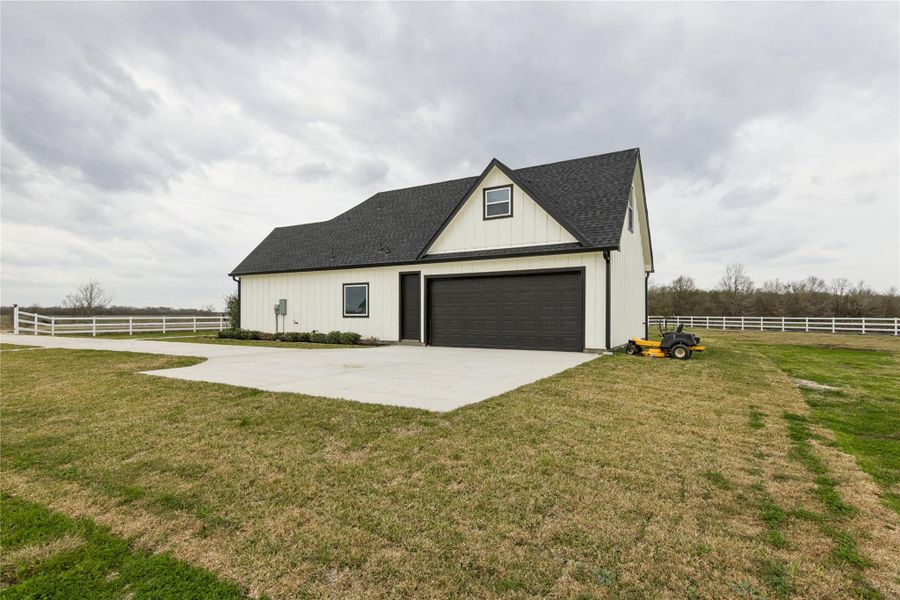 Front exterior of a new home in , Sealy, TX, highlighting curb appeal (Image 23).