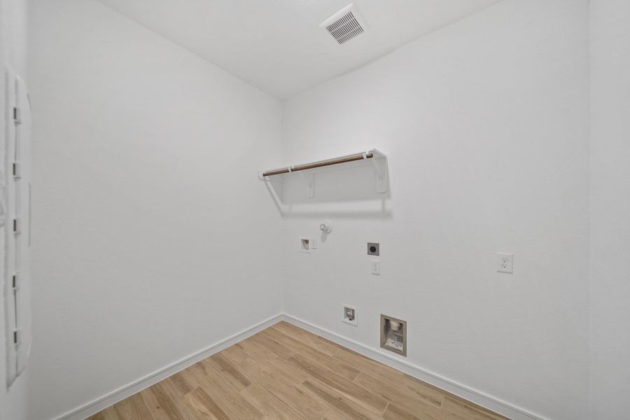 Laundry room (*Photo not of actual home and used for illustration purposes only.)